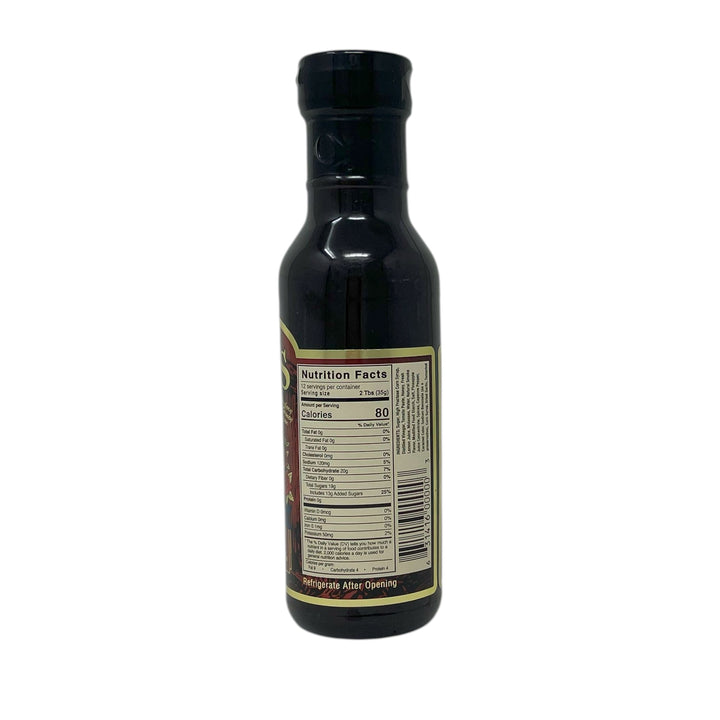 Bottle of syrup with nutrition facts label on a white background