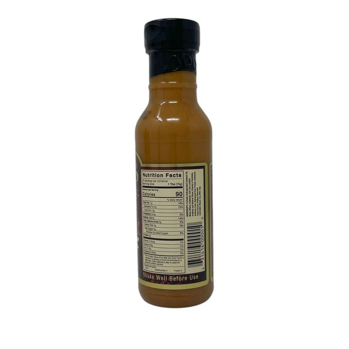 Bottle of sauce with a label on a white background