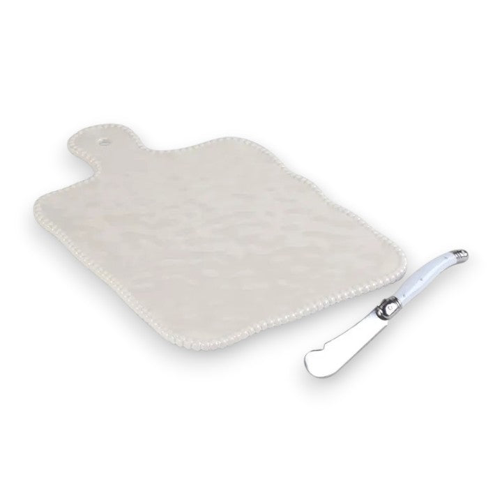 White hand-shaped hot water bottle with a silver plug on a white background