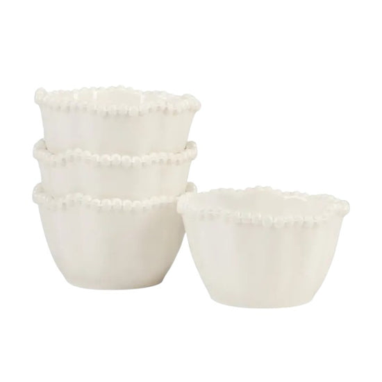 Set of three white ceramic bowls with decorative rims on a white background