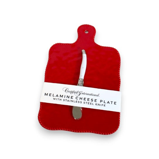 Red melamine cheese plate with a knife on a white background