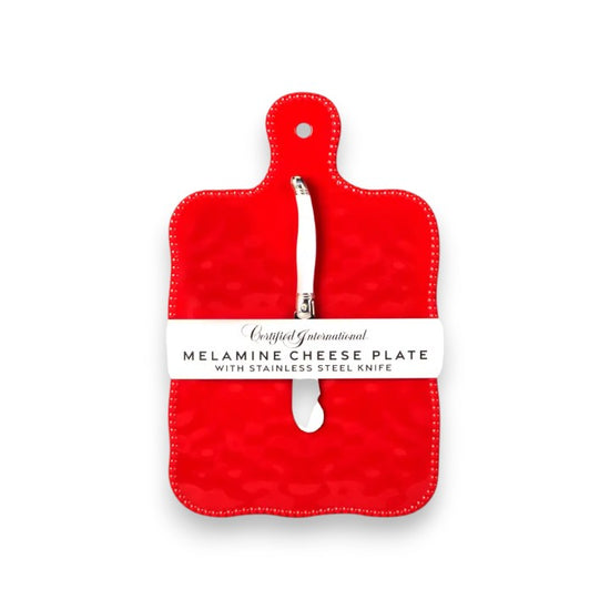 Red melamine cheese plate with a knife on a white background