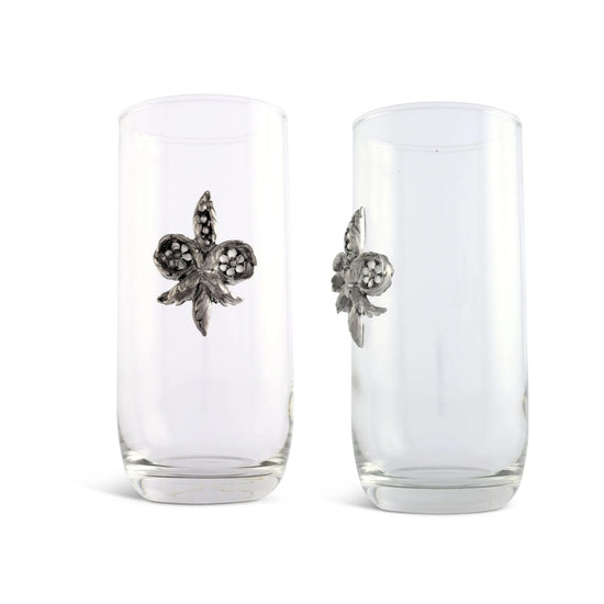 A close-up shot of the hand-crafted pewter Fleur De Lis medallion on the side of the hand-blown glass.