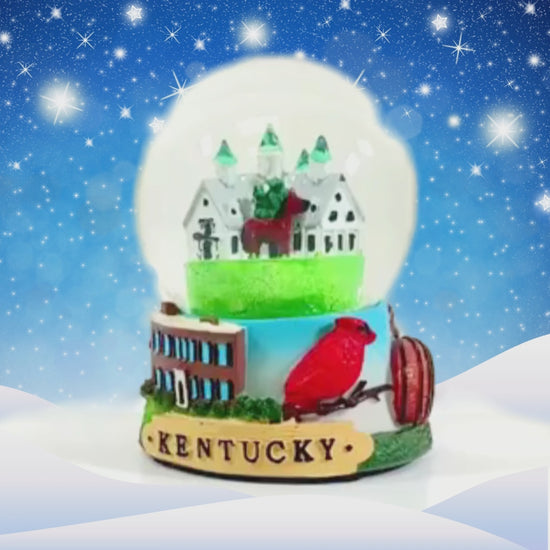 The Kentucky Snow Globe featuring a Churchill Downs-style barn against a white background.