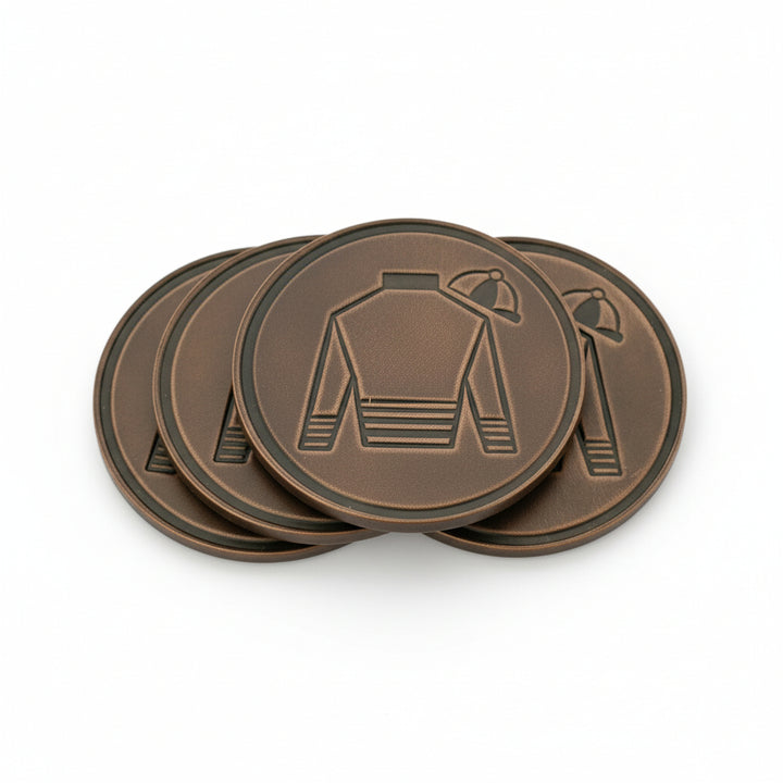 A set of four brown Horween leather coasters featuring a debossed jockey silk design, arranged on a white background