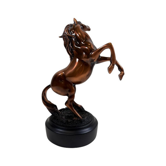 Side profile of the rearing horse statue, highlighting the hand-finished copper texture and sturdy black base.