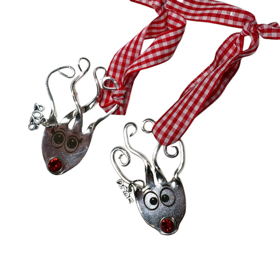 A pair of Boy and Girl Reindeer ornaments shown together as a set.