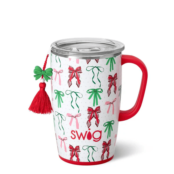 Swig 18oz travel mug in Ribbons and Bows print with a red handle and festive bow charm attached.
