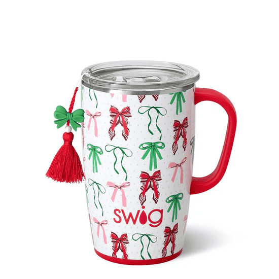 Swig 18oz travel mug in Ribbons and Bows print with a red handle and festive bow charm attached.