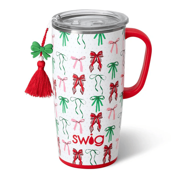 Swig 22oz travel mug in Ribbons and Bows print with a red handle and a matching holiday bow charm.