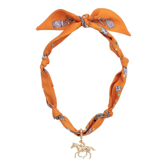 Front view of the Riders Up Scarf Necklace in Orange featuring an 18K gold-plated pendant.