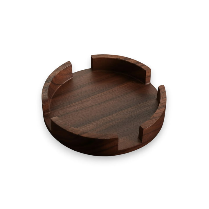 A top-down view of the empty Round Walnut Coaster Caddy, showcasing the rich wood grain and circular design.
