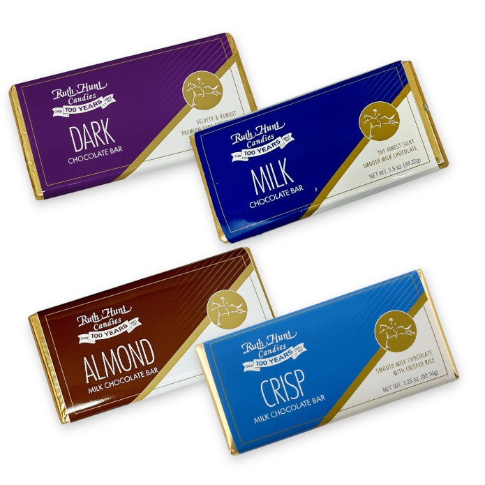 An assortment of four Ruth Hunt Chocolate Bars: Milk, Dark, Crisp, and Almond flavors.