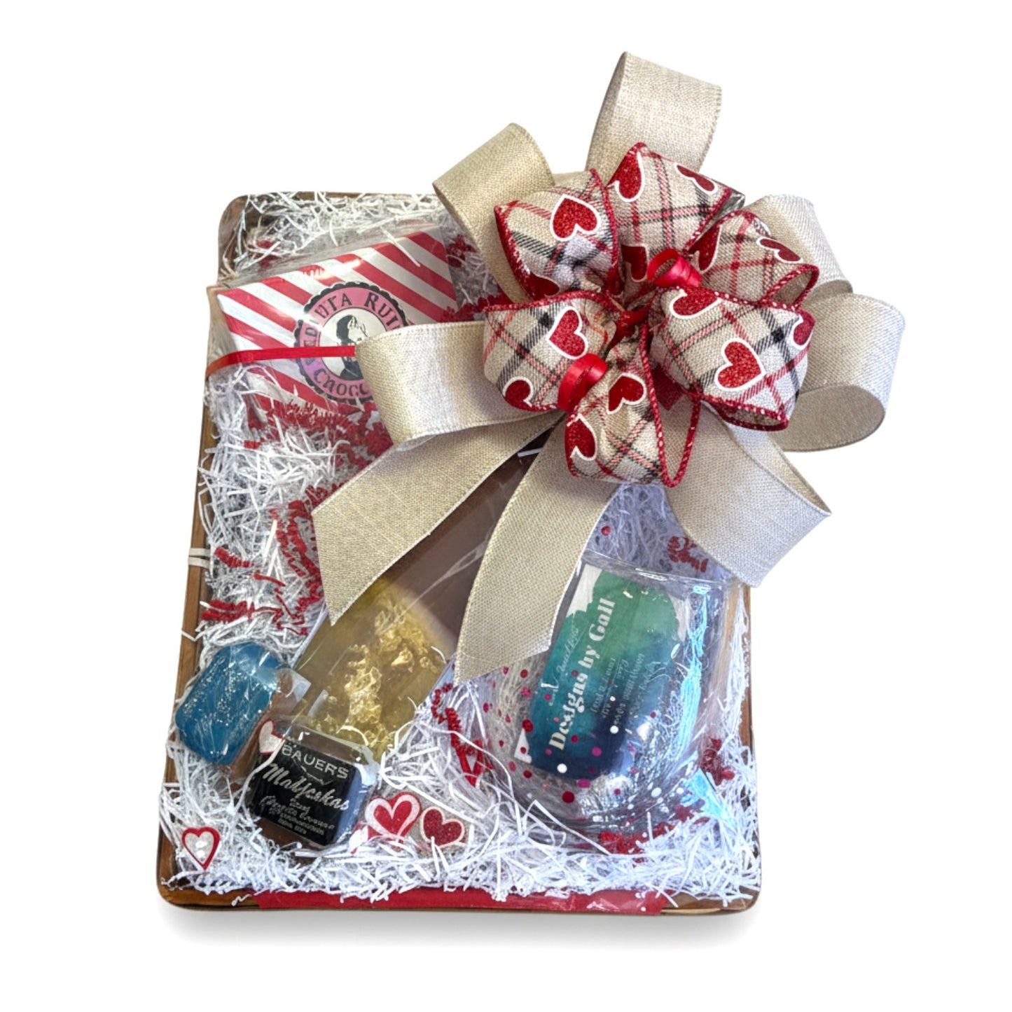 The Sip & Savor Gift Basket beautifully arranged, featuring a wine chiller, a stemless wine glass, and Kentucky bourbon sweets.