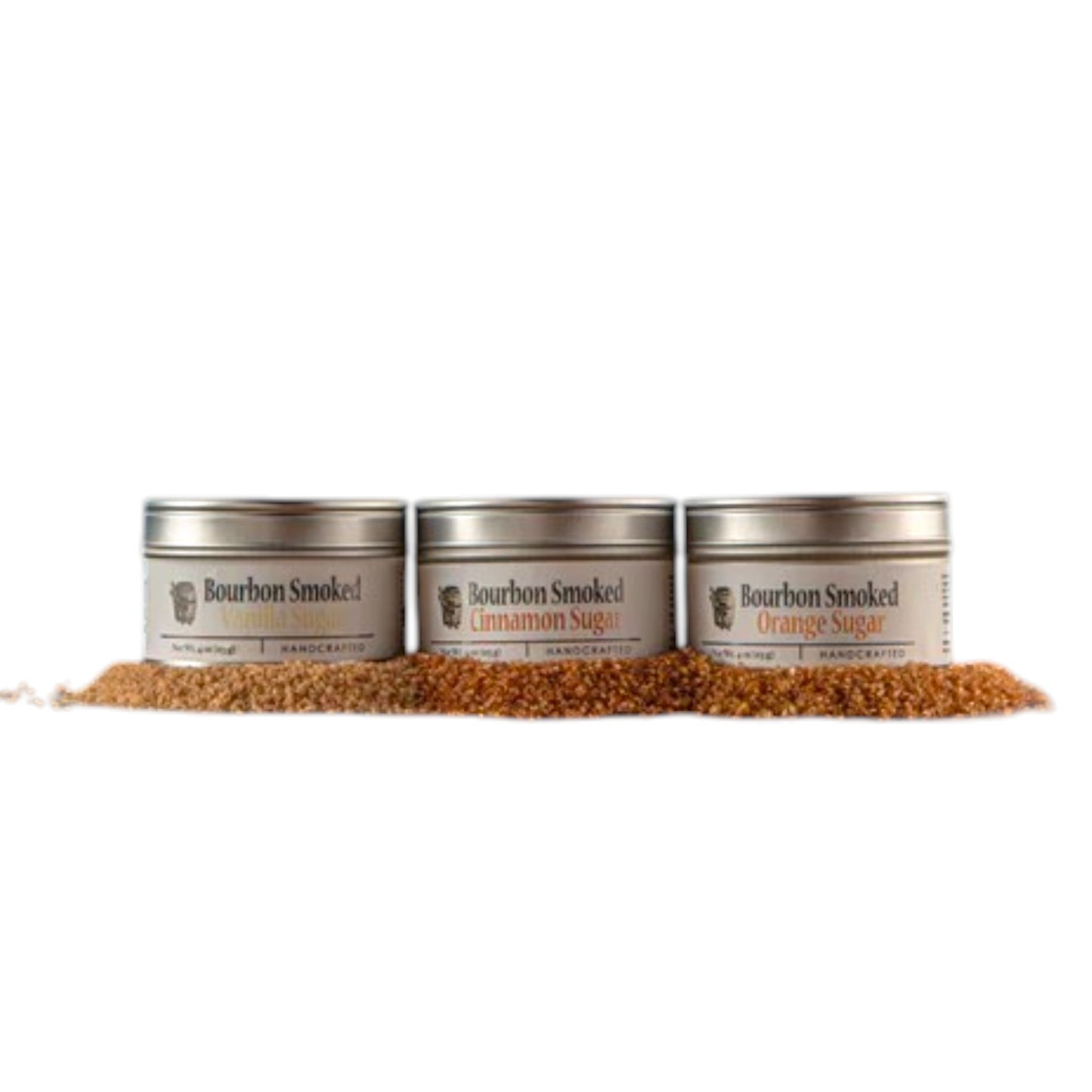 Three separate tins showcasing the Bourbon Smoked Cinnamon, Vanilla, and Orange Sugar labels.