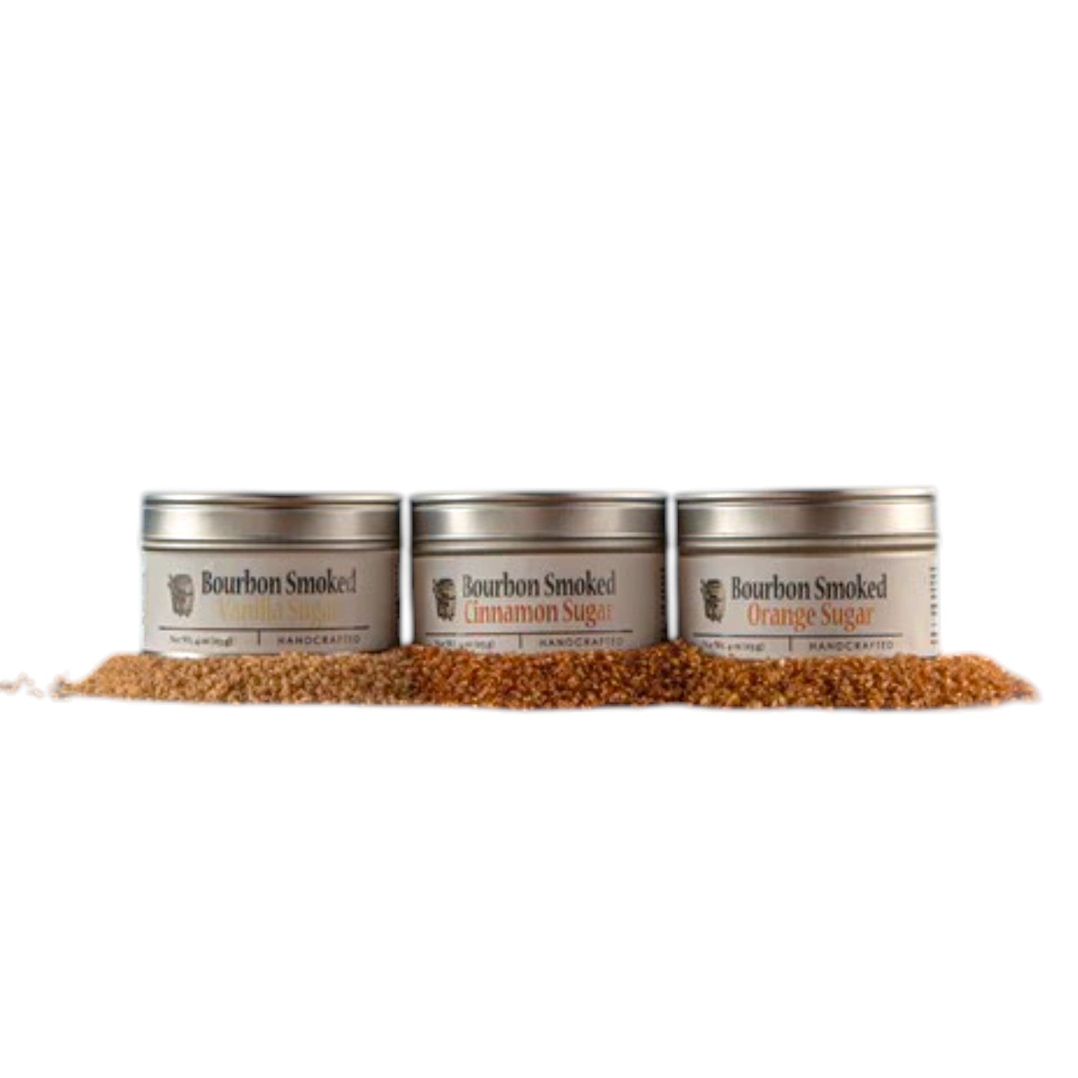 Three separate tins showcasing the Bourbon Smoked Cinnamon, Vanilla, and Orange Sugar labels.