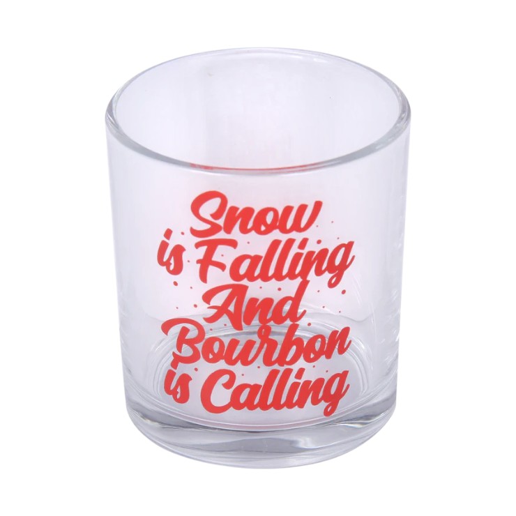 Clear glass with red text 'Snow is Falling And Bourbon is Calling' on a white background
