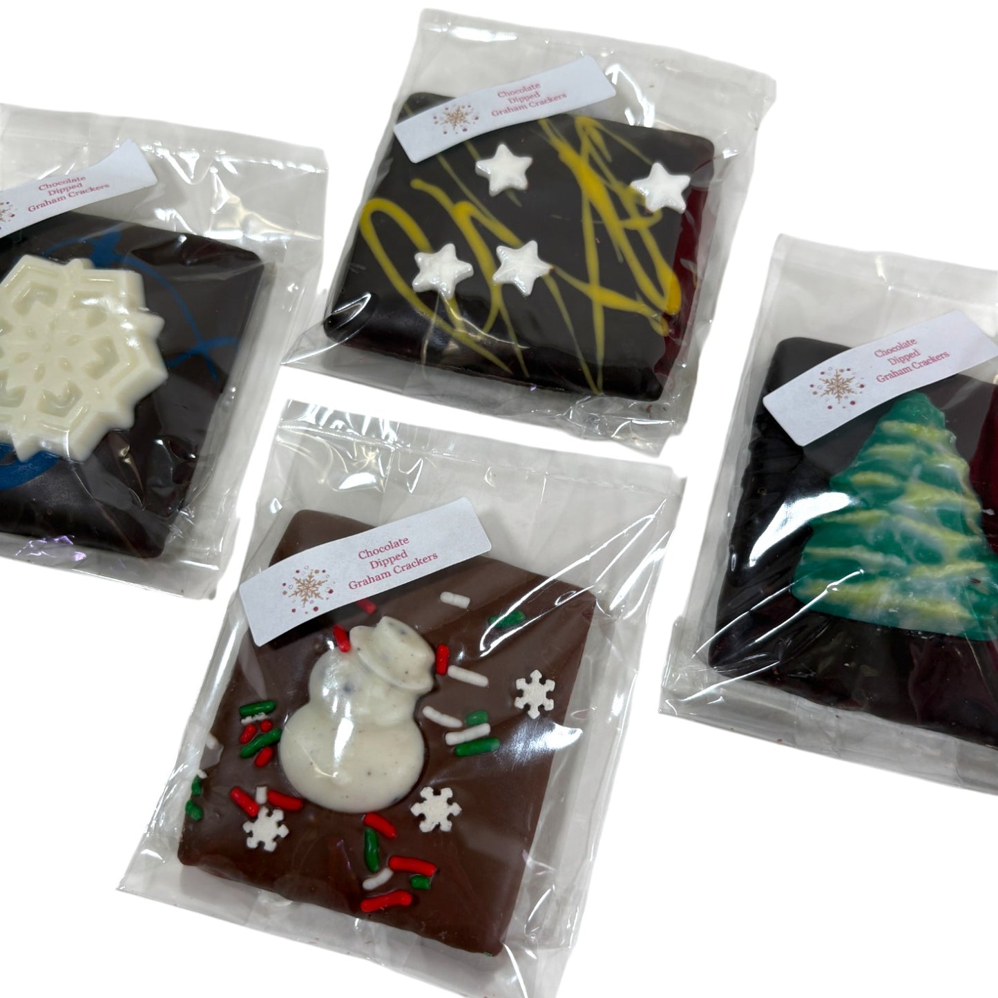 A detailed close-up shot of the different holiday designs, including a snowman and a Christmas tree.