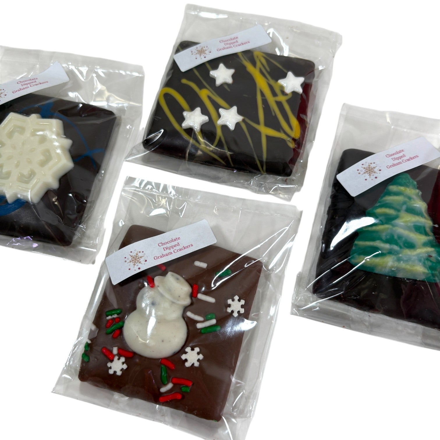 A detailed close-up shot of the different holiday designs, including a snowman and a Christmas tree.