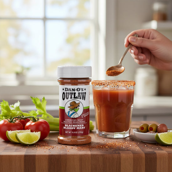 A Bloody Mary cocktail featuring a glass rimmed generously with Dan-O's Blackened seasoning.