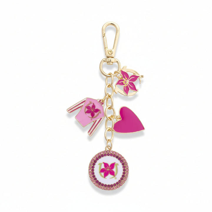 Full view of the Stargazer Pink Jockey Silk Cluster Bag Charm, showing the pink enamel silk, gold star charms, and beads on a white background.