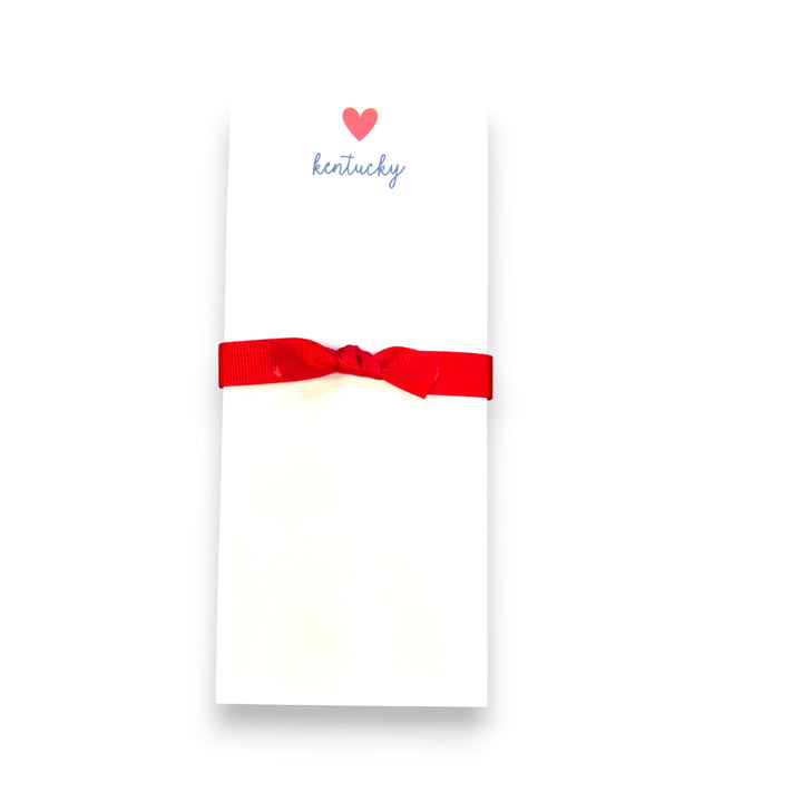 Notepad with a red ribbon and 'Kentucky' text on a white background