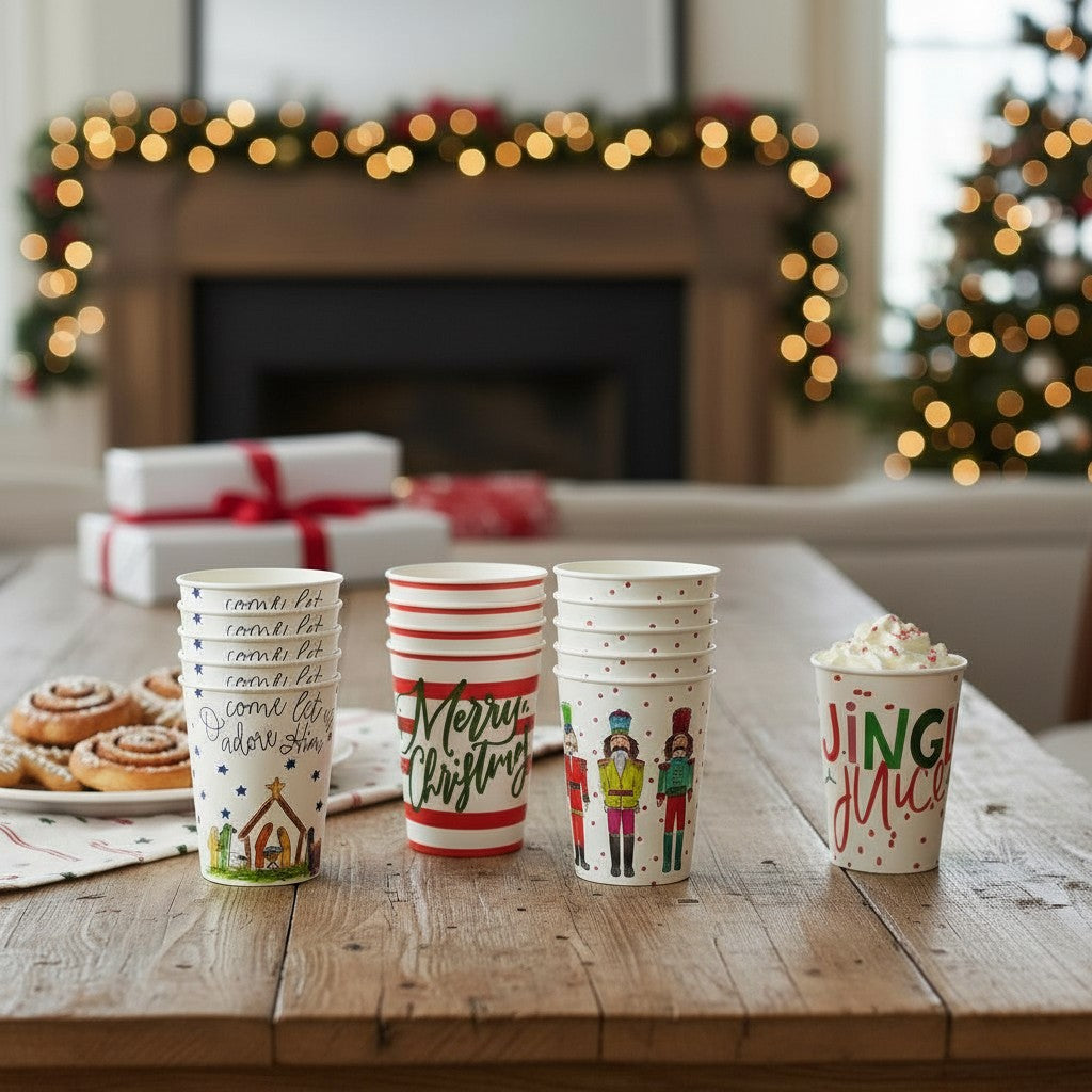 A holiday party table set with festive reusable cups and Christmas treats.