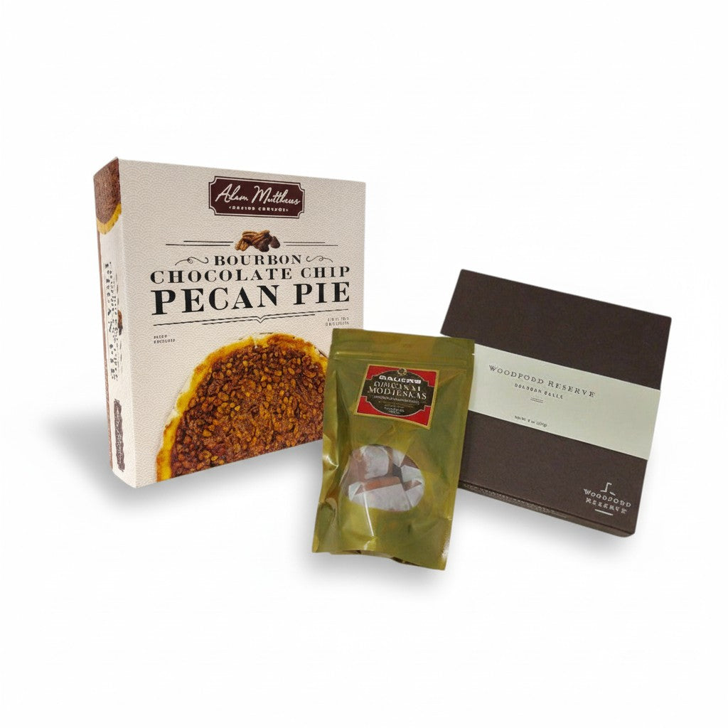 The Sweet Trio gift set featuring a Bourbon Chocolate Chip Pecan Pie, a box of Woodford Reserve Bourbon Balls, and Bauer's Modjeskas.