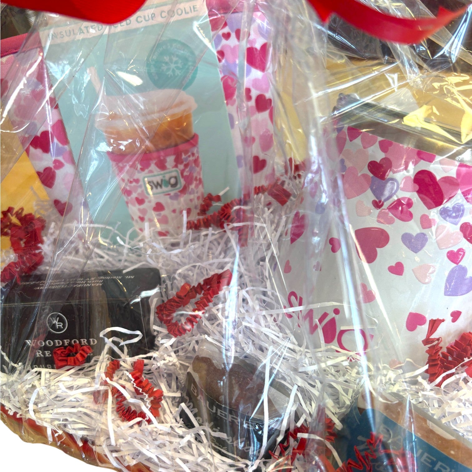 A close-up of the stylish pink-themed Swig Coolie included in the gift set.