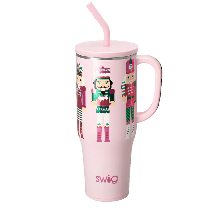 Pink 40oz Swig Mega Mug with Sugar Plum Soldier nutcracker pattern and handle.