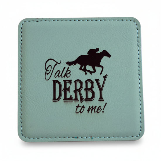 A square mint green faux leather coaster featuring a dark brown jockey silhouette and "Talk DERBY to me!" text.