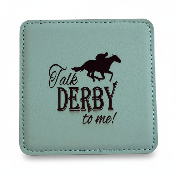 A square mint green faux leather coaster featuring a dark brown jockey silhouette and "Talk DERBY to me!" text.