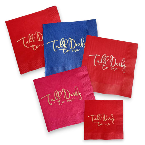 Collection of "Talk Derby to Me" napkins in navy, hot pink, and red with gold and silver foil accents.