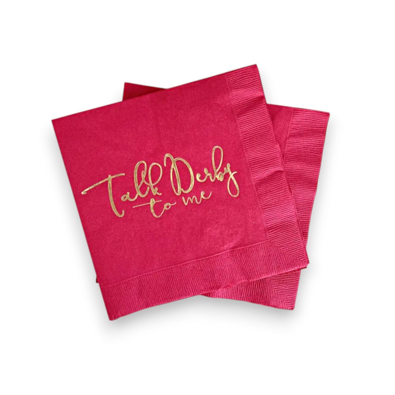 Pink napkins with gold text 'Talk Derby to me' on a white background