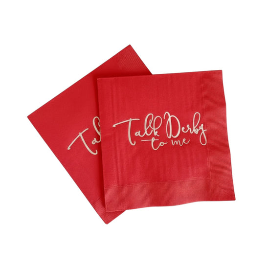Red napkin with 'Talk Derby to me' text on a white background