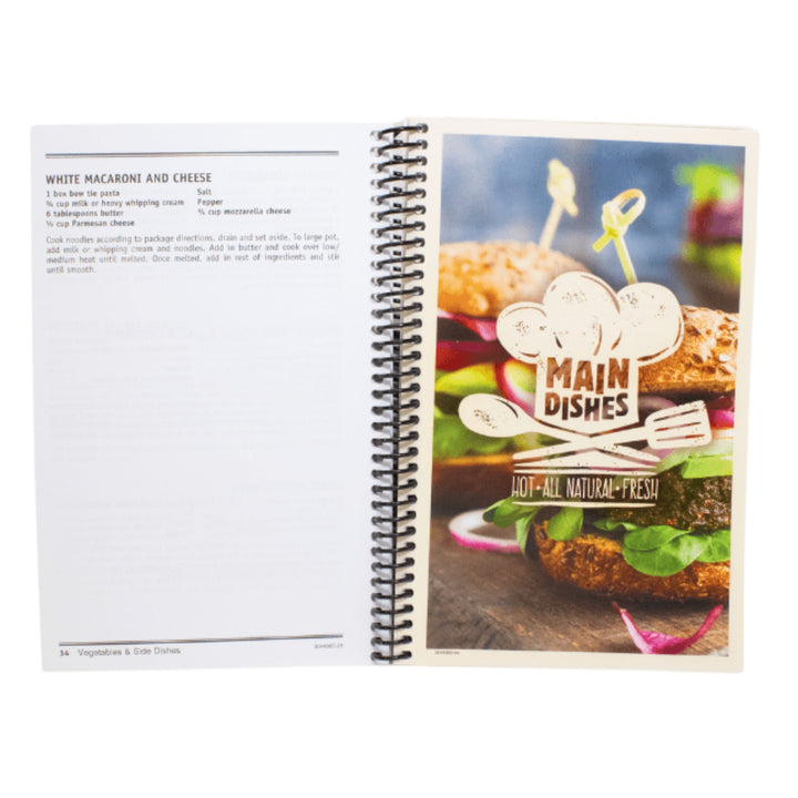 Open spiral-bound cookbook with a page showing a burger and 'Main Dishes' branding.