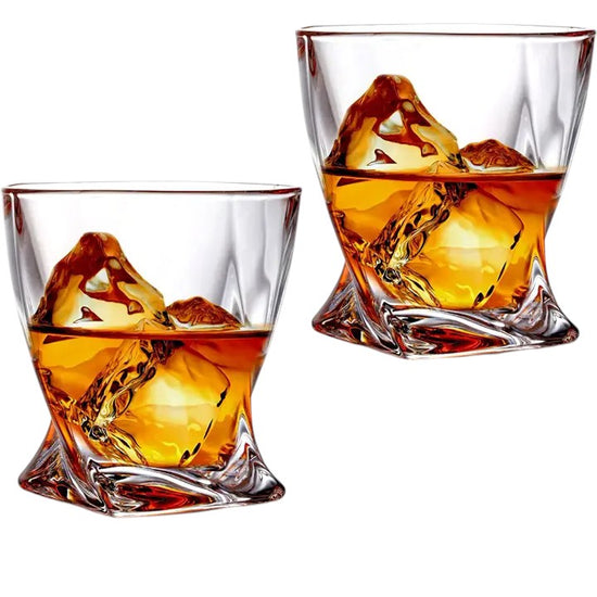 Twisted 10 oz whiskey glass with sculpted base and mountain ice.