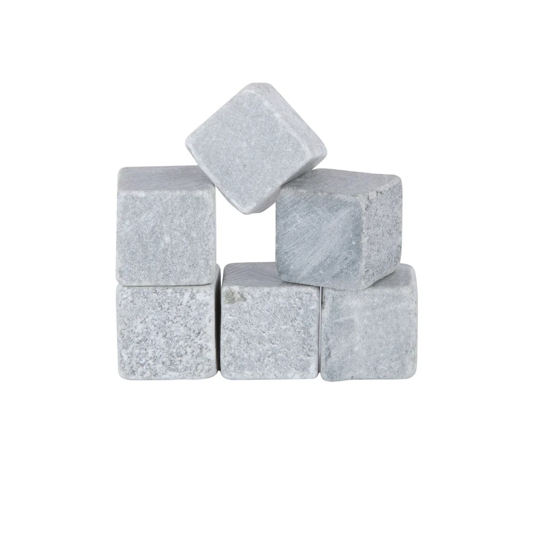 A set of six gray Viski Glacier Rocks soapstone cubes arranged neatly.