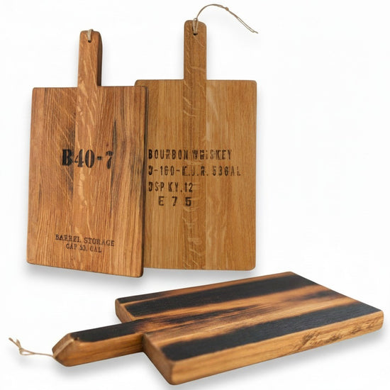 Whiskey Stave Charcuterie Board handcrafted from reclaimed whiskey barrel staves with warm natural wood grain.