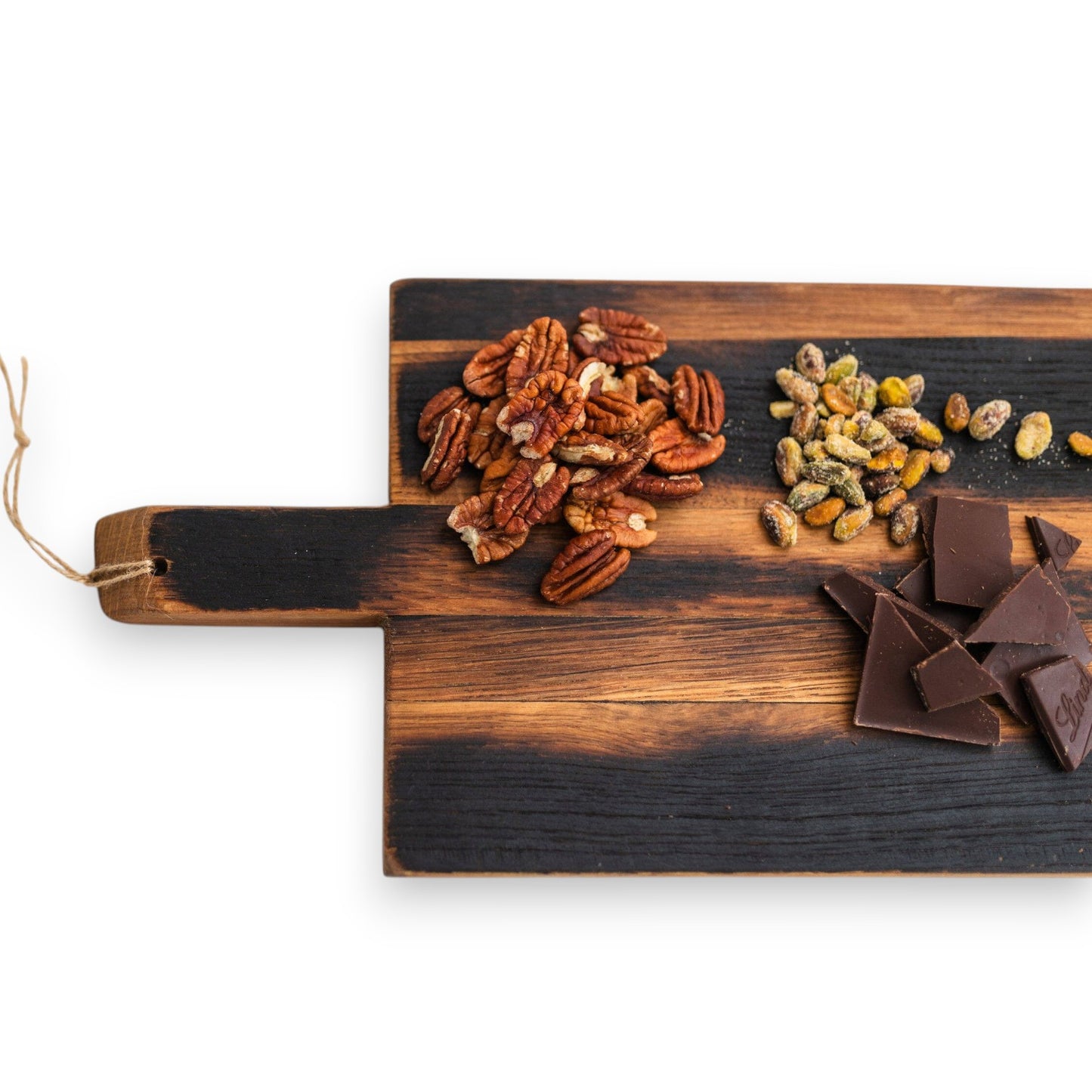 Warm tones and one-of-a-kind wood grain of the reclaimed whiskey barrel stave charcuterie board.