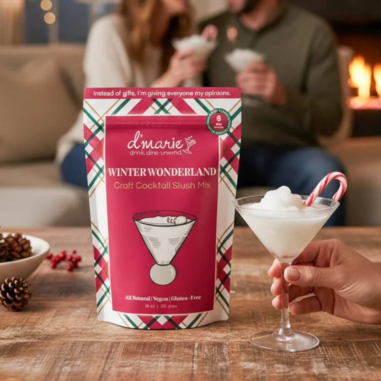 d'marie Winter Wonderland craft cocktail slush mix with a cocktail and candy cane on a table.