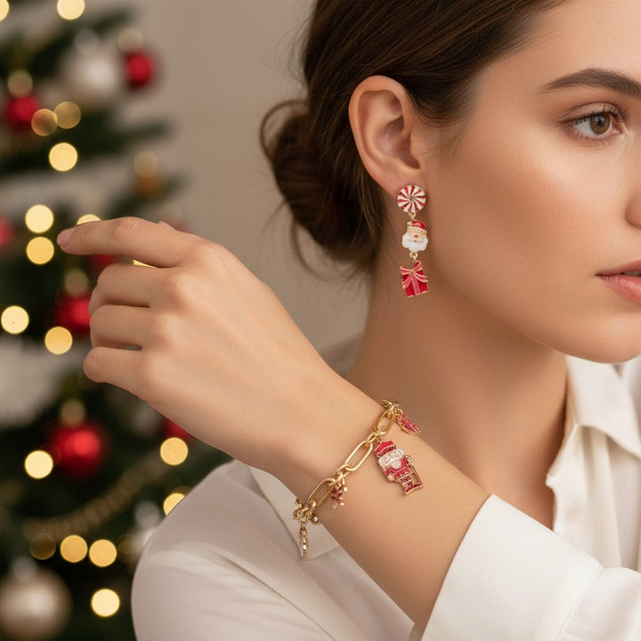 A woman smiling while wearing the festive Christmas Cheer charm necklace and drop earrings.