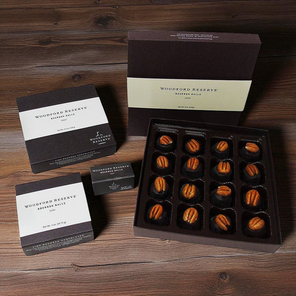 Woodford Reserve bourbon balls packaging on a wooden surface
