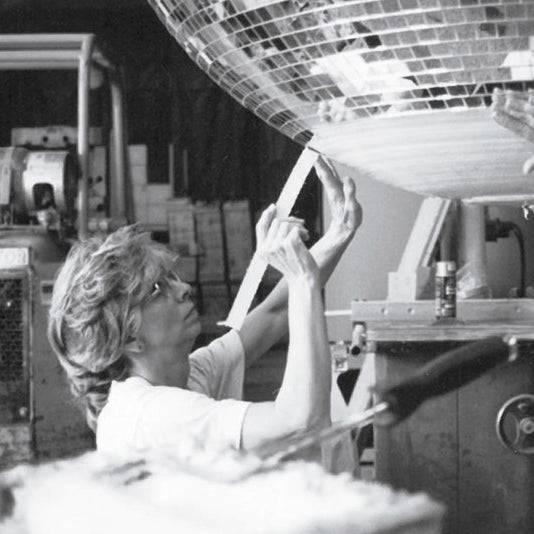 Archival image of artisan Yolanda Baker in her Louisville workshop, whose legacy inspires Omega Mirror's craftsmanship.
