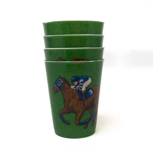 four stacked green shot glasses with horse and jockey illustration.