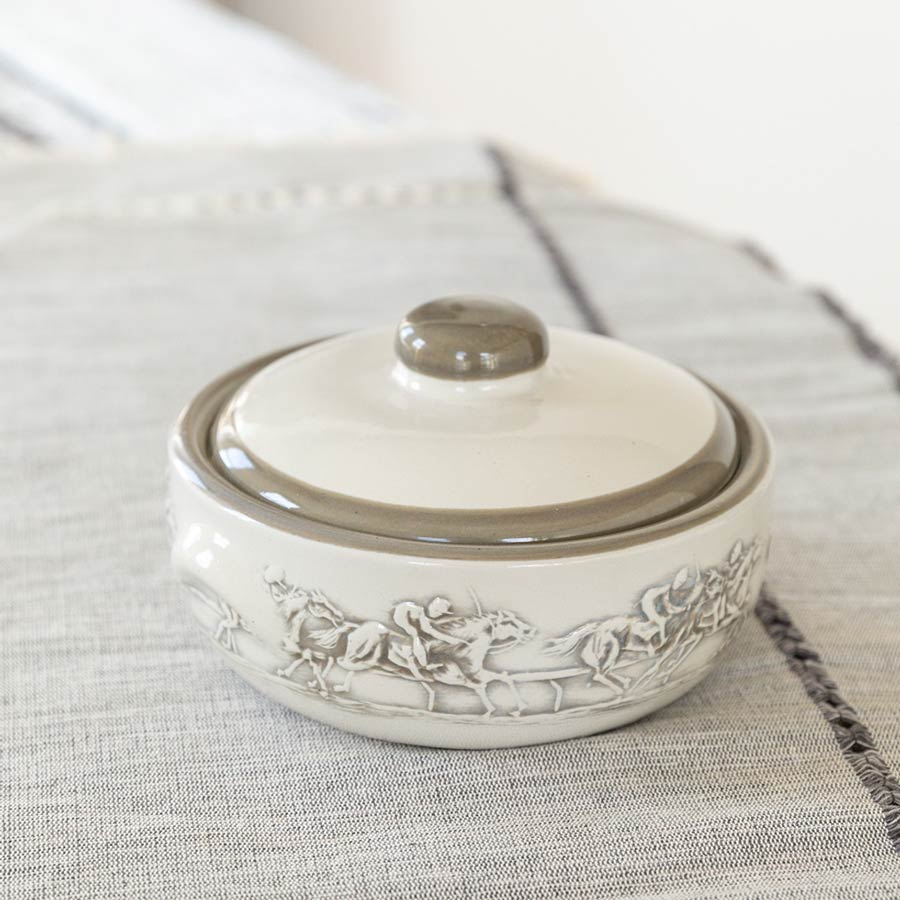 1 quart casserole dish with lid from Stoneware & Co in design Embossed Running Horse, on cloth table covering.