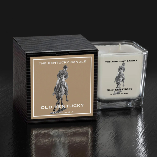 White Square Glass Candle in Old Kentucky Scent sitting next to Black packaging box. Sitting on black background.