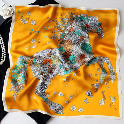 Orange scarf with white and teal floral horse design