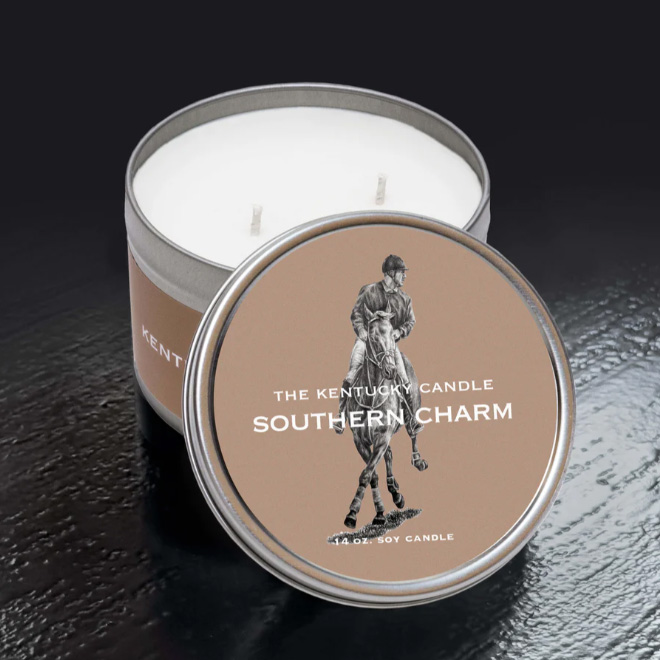 Round White Tin Candle in Southern Charm Scent. Sitting on black background.